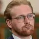 Jānis Zariņš Pievienojas Jaunās Vienotības Frakcijai Saeimā: Īslaicīgs Mandāts Politisko Rokāžu Ēnā